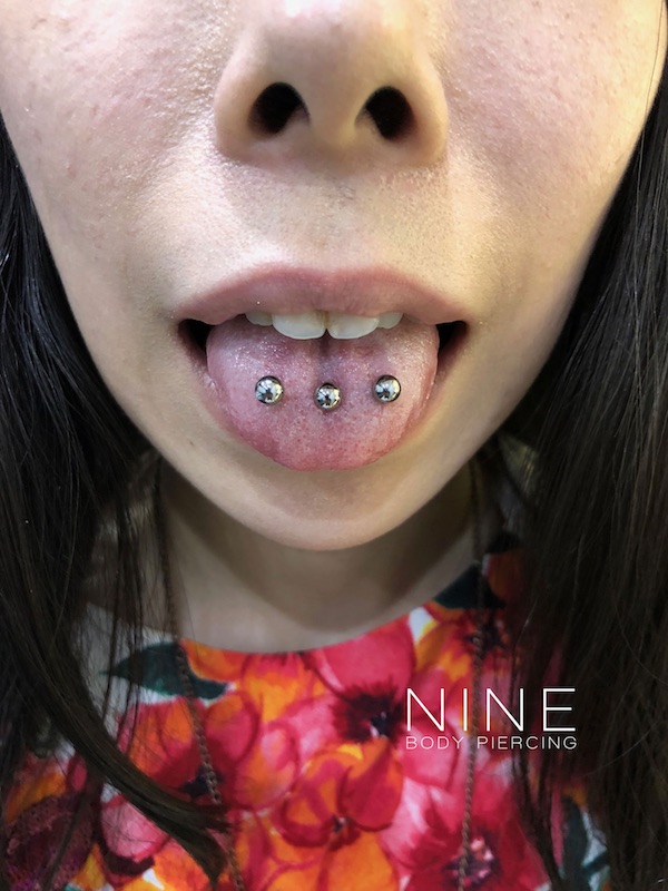 Piercing raw tongue girl